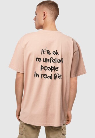 T-Shirt 'Unfollow' Merchcode en rose