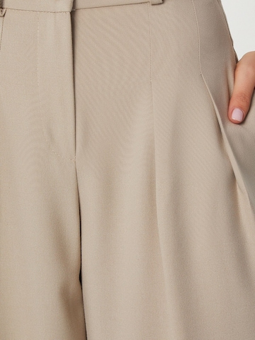 Happiness İstanbul Barrel Pleat-front trousers in Beige