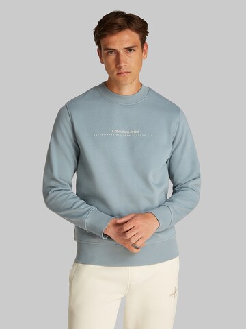 Sweat-shirt Calvin Klein Jeans en bleu : devant