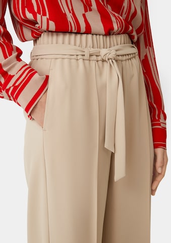 Wide leg Pantaloni con piega frontale di COMMA in beige