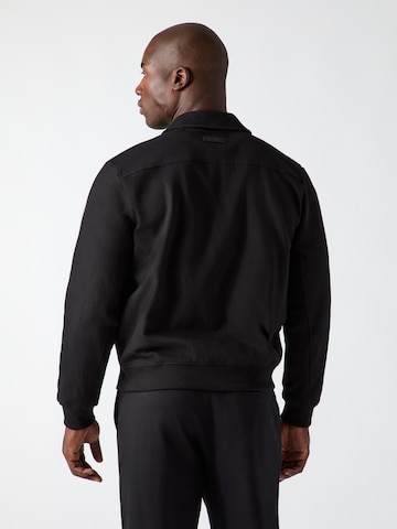 GUESS - Sudadera con cremallera en negro