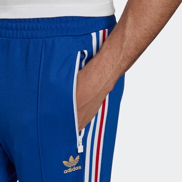 ADIDAS ORIGINALS Normalny krój Spodnie 'Beckenbauer' w kolorze niebieski