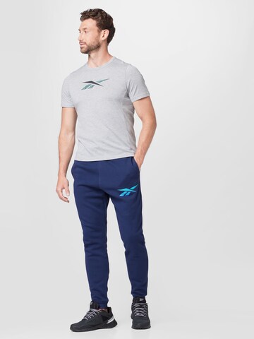 Effilé Pantalon de sport Reebok en bleu