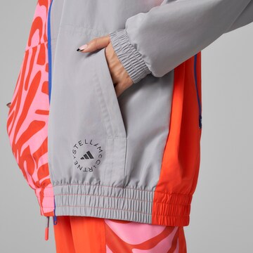 ADIDAS BY STELLA MCCARTNEY - Chaqueta de chándal en naranja