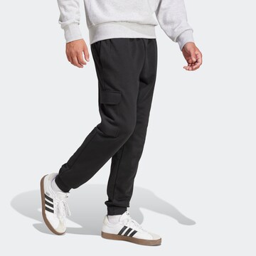 ADIDAS SPORTSWEAR Конический (Tapered) Спортивные штаны 'Essentials' в Черный