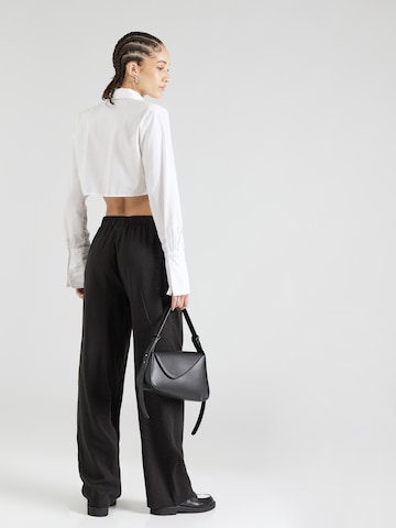 Largi Pantaloni 'Darrel' de la modström pe negru
