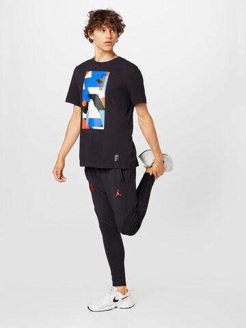 NIKE - Tapered Pantalón deportivo en negro