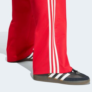 ADIDAS ORIGINALS Loose fit Athletic Pants in Red