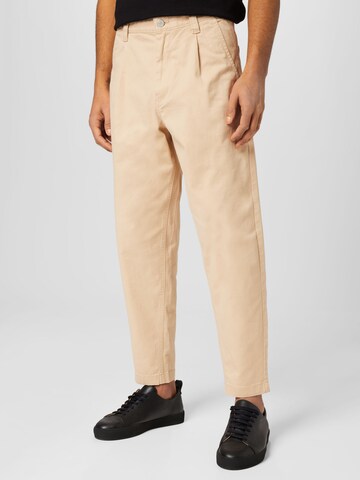 Effilé Pantalon chino Tommy Jeans en beige : devant