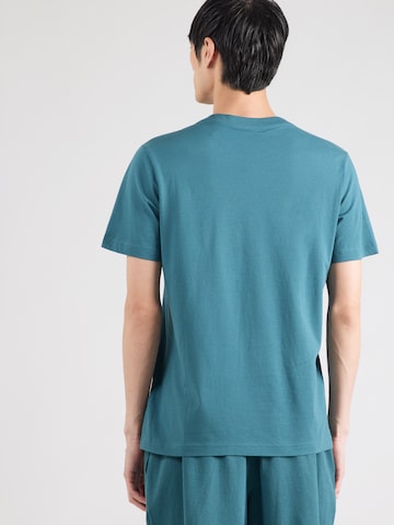 PUMA Λειτουργικό μπλουζάκι 'Essentials No. 1' σε πράσινο