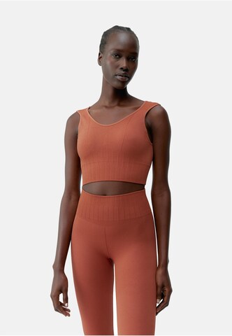 Born Living Yoga Top 'Annapurna' in Orange: front