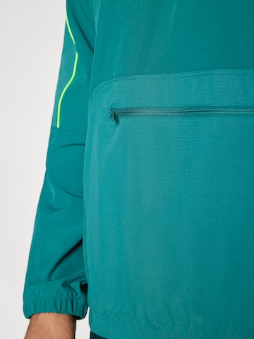 UNDER ARMOUR Αθλητικό μπουφάν 'Challenger' σε πράσινο