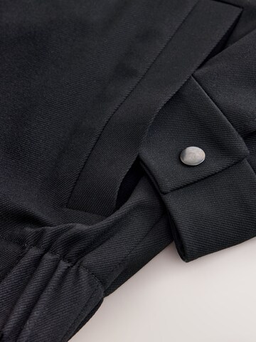 Next - Chaqueta de entretiempo 'Motionflex' en negro
