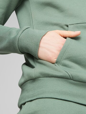 PUMASportska sweater majica 'Essential' - zelena boja