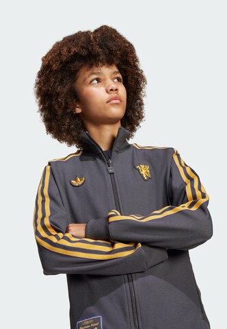 Veste mi-saison 'Manchester United Terrace Icons' ADIDAS ORIGINALS en noir