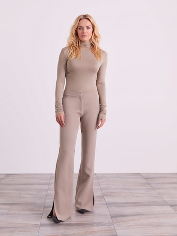 ABOUT YOU x Iconic by Tatiana Kucharova Flared Trousers 'Edina' in Beige