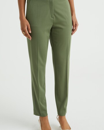 Slimfit Pantaloni con piega frontale di WE Fashion in verde