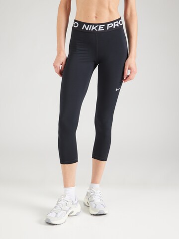 NIKE Skinny Workout Pants in Black: front