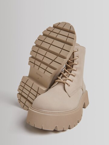 Bershka Lace-up bootie in Beige