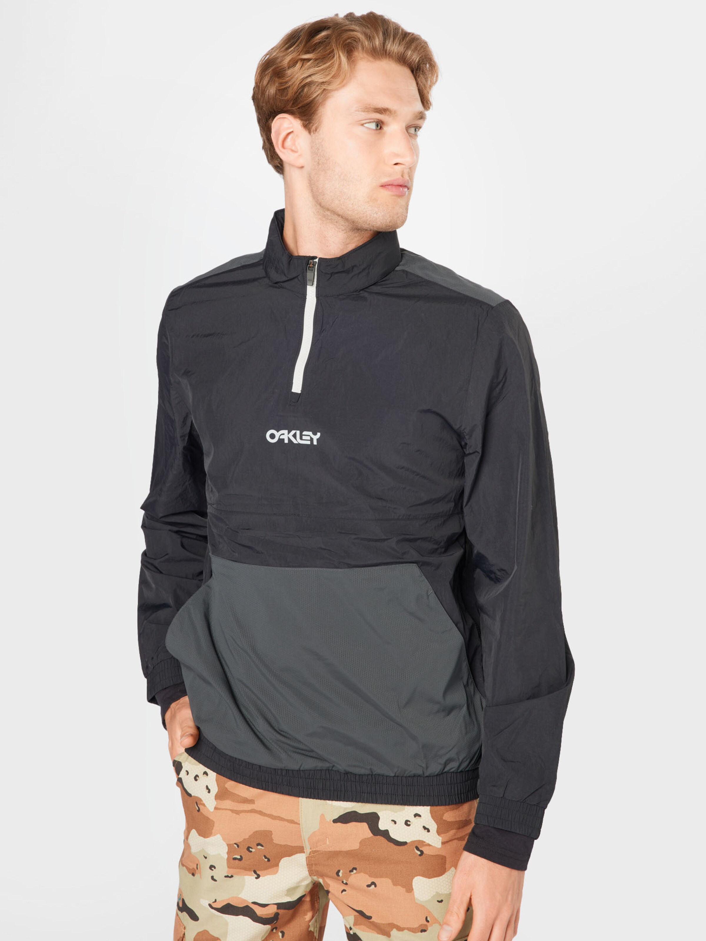 Männer Sportarten OAKLEY Sportjacke in Schwarz - WC85679 Männer Sportarten OAKLEY Sportjacke in Schwarz - WC85679