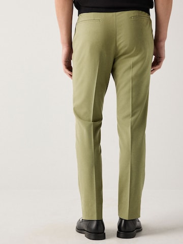 Skinny Pantalon à plis Next en vert