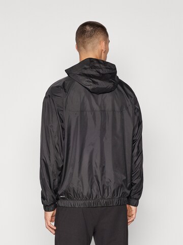 PUMA - Casaco deportivo 'ESS' em preto