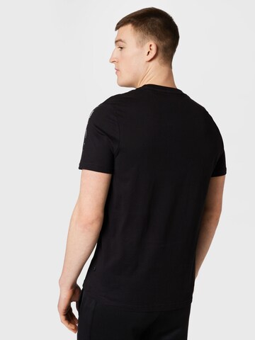 PUMA T-Shirt 'Essentials+' in Schwarz