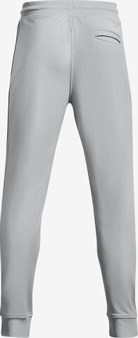 Effilé Pantalon de sport UNDER ARMOUR en gris