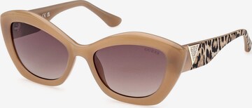 Lunettes de soleil GUESS en beige : devant