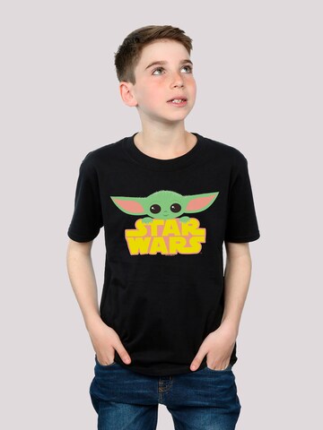 T-Shirt 'Star Wars The Mandalorian The Child' F4NT4STIC en noir : devant