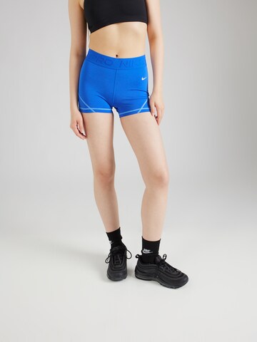 Skinny Pantalon de sport 'NVLTY' NIKE en bleu : devant