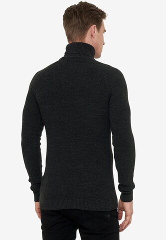 Rusty Neal Pullover mit stilvollem Rollkragen in Schwarz