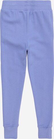 Effilé Pantalon de sport UNDER ARMOUR en bleu