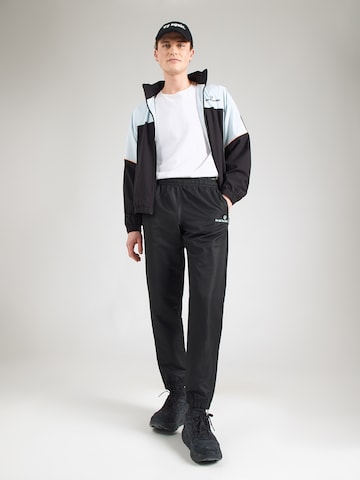 Sergio Tacchini Tapered Παντελόνι 'CARSON 021' σε μαύρο