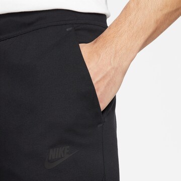 Nike SportswearTapered Hlače 'Tech Essentials' - crna boja