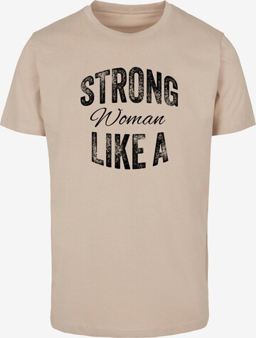 Merchcode Shirt 'Strong Like A Woman' in Beige: voorkant