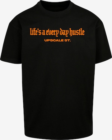 MT Upscale T-shirt 'Hustle' i svart: framsida