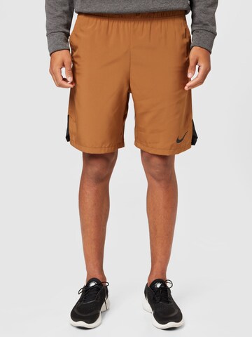 Regular Pantalon de sport NIKE en marron : devant