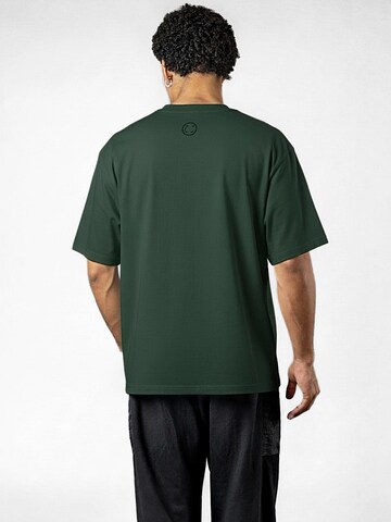 UNORGANIZED BRAND T-shirt 'SCHWERES COMFORT T15' i grön