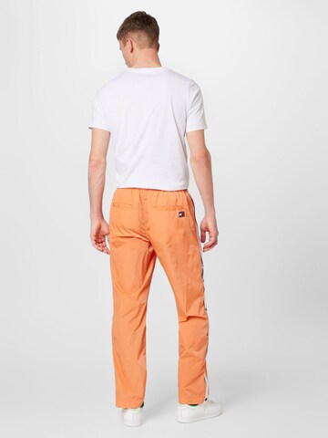 Loosefit Pantalon Tommy Jeans en orange