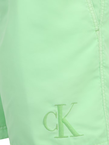 TOMMY HILFIGER Plavecké šortky – zelená