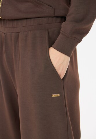 Athlecia Tapered Sportbroek 'Jillnana V2' in Bruin
