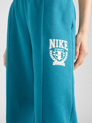 žalia Nike Sportswear Siaurėjantis Kelnės