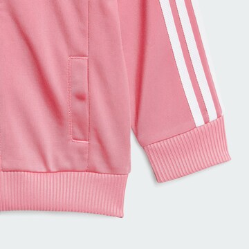 ADIDAS ORIGINALS Träningsoverall 'Adicolor' i rosa