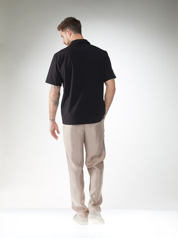 ABOUT YOU x Kevin Trapp Loose fit Pleat-front trousers 'Ron' in Brown