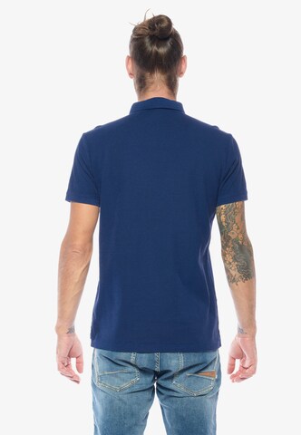 Le Temps Des Cerises Poloshirt 'DYLON' in Blau