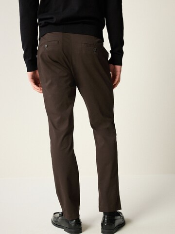 Slimfit Pantaloni chino di Next in marrone