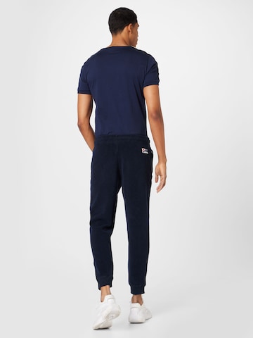 Superdry Tapered Byxa i blå