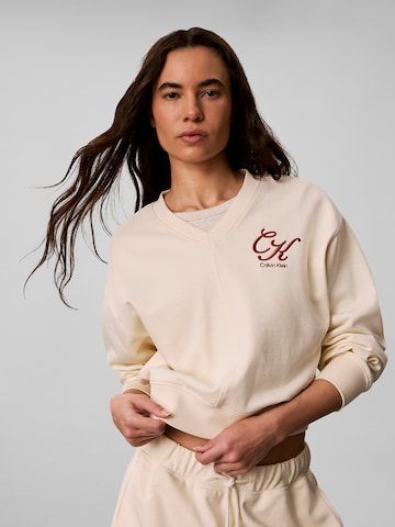 Sweat-shirt Calvin Klein Jeans en beige : devant