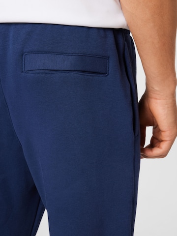 Nike Sportswear Zúžený Kalhoty 'Club Fleece' – modrá
